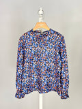 Floral top with small bow and ruffle for girl