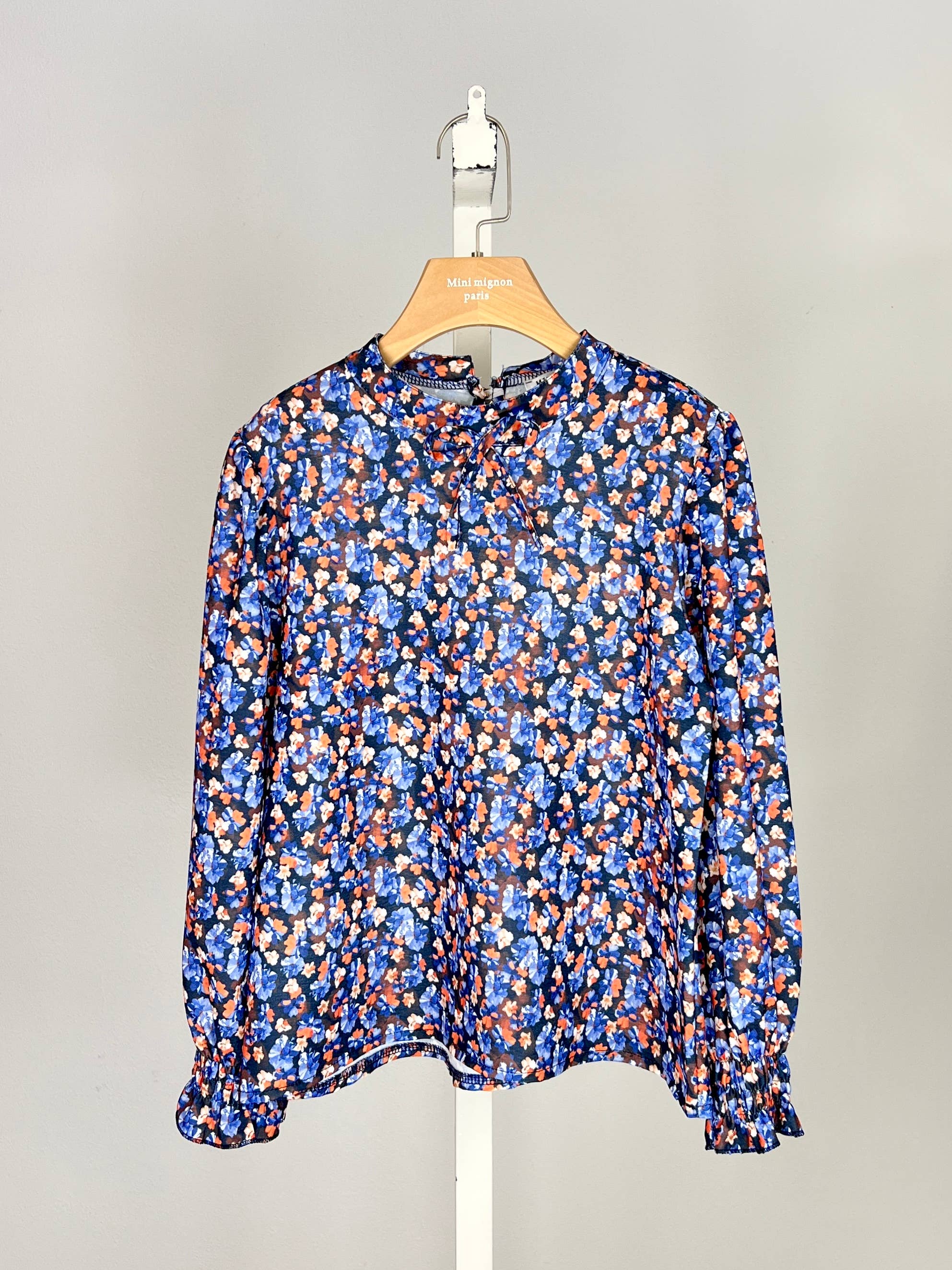 Floral top with small bow and ruffle for girl