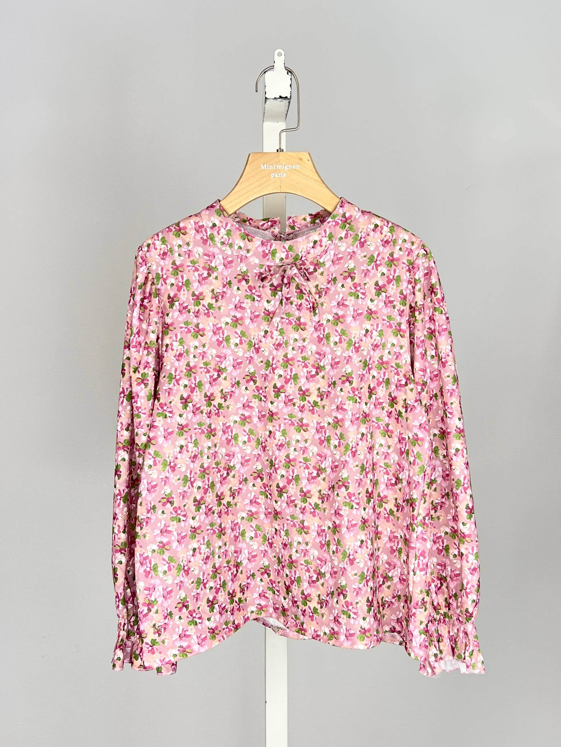 Floral top with small bow and ruffle for girl
