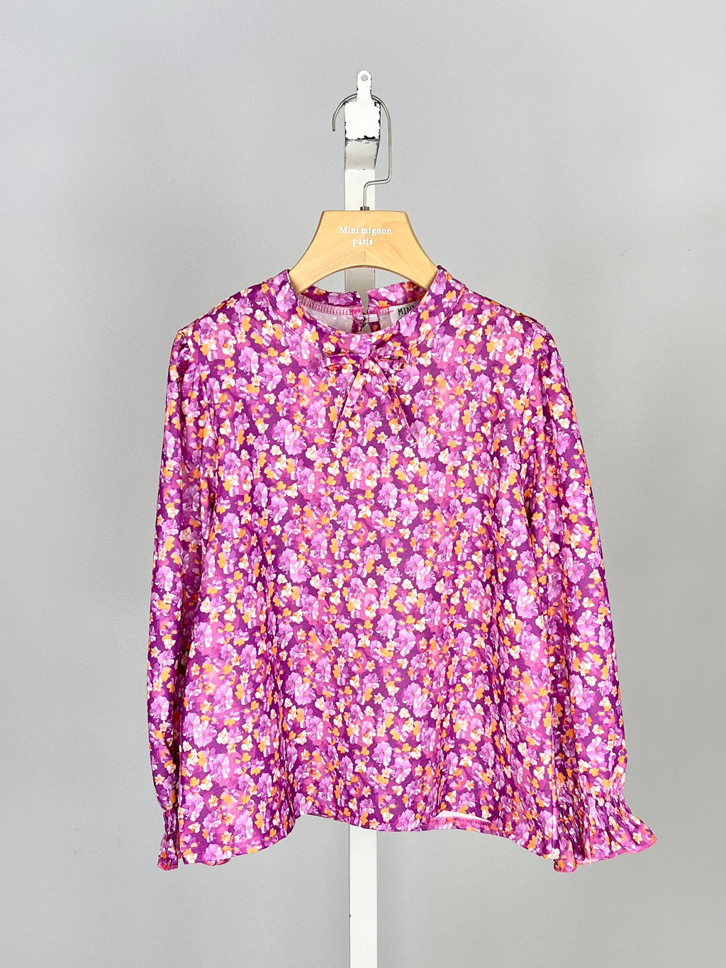 Floral top with small bow and ruffle for girl