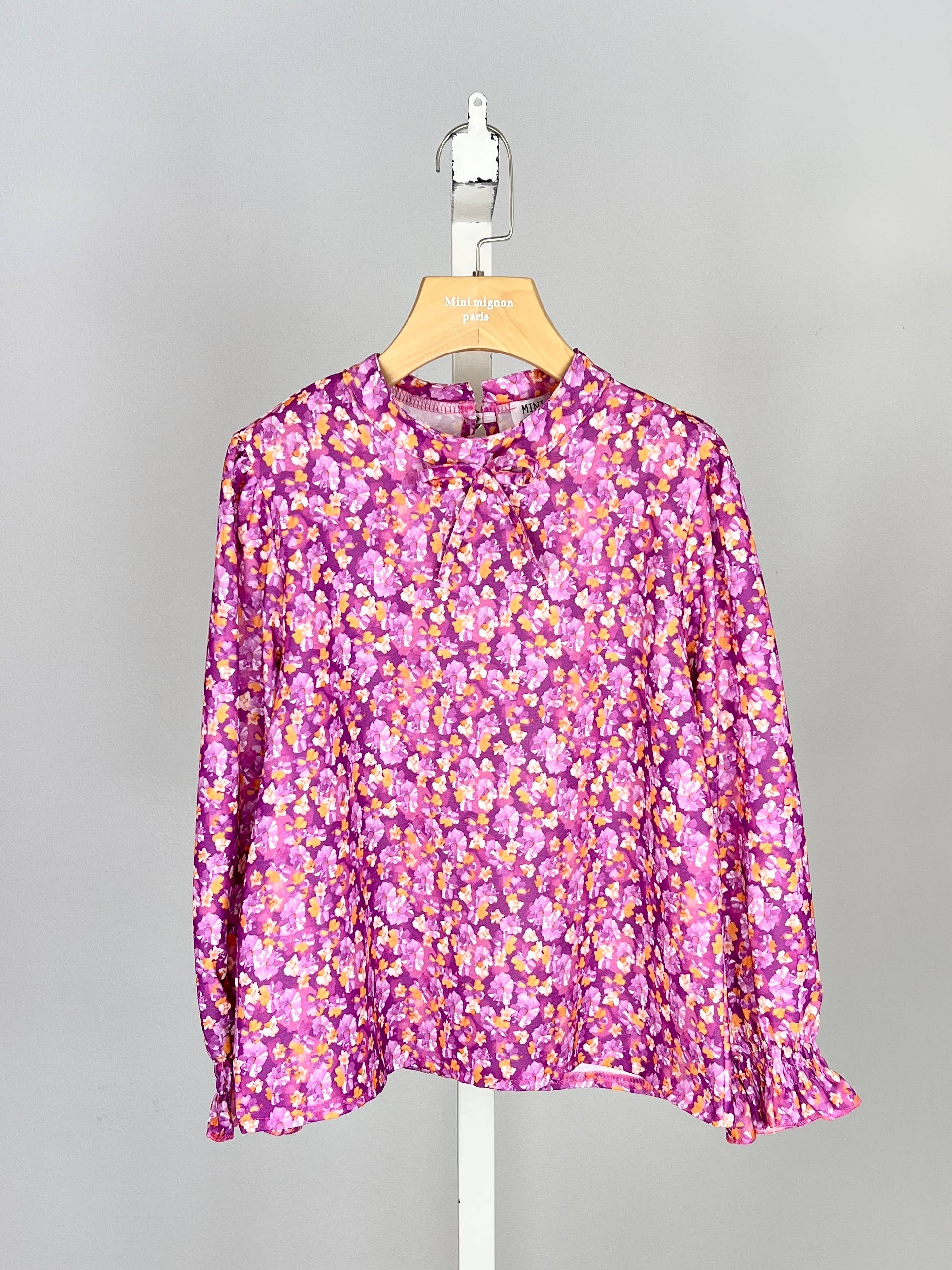 Floral top with small bow and ruffle for girl