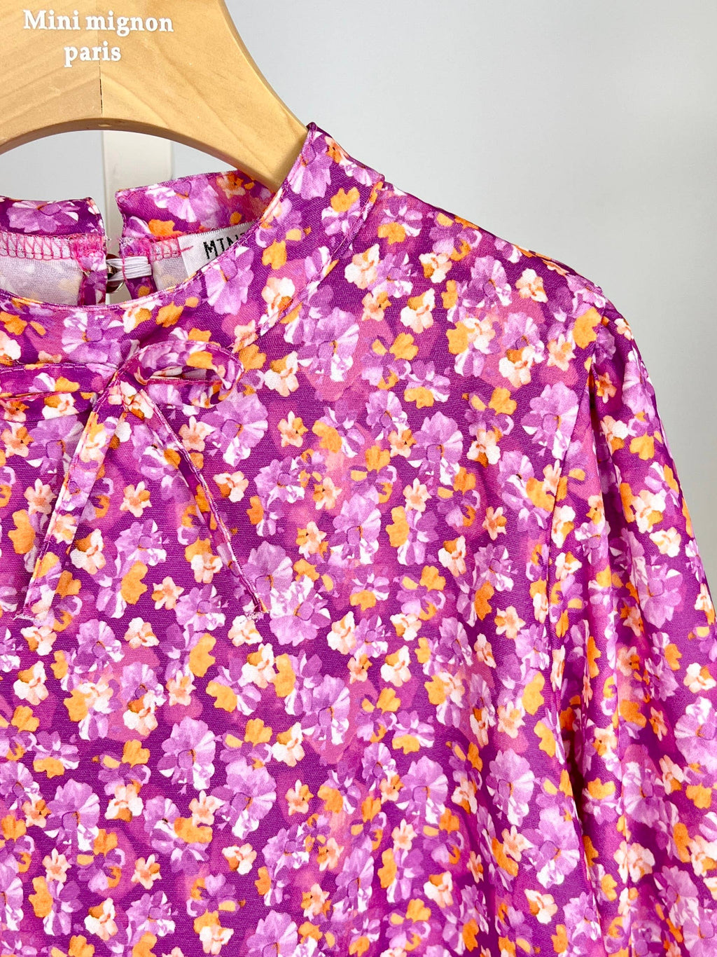 Floral top with small bow and ruffle for girl