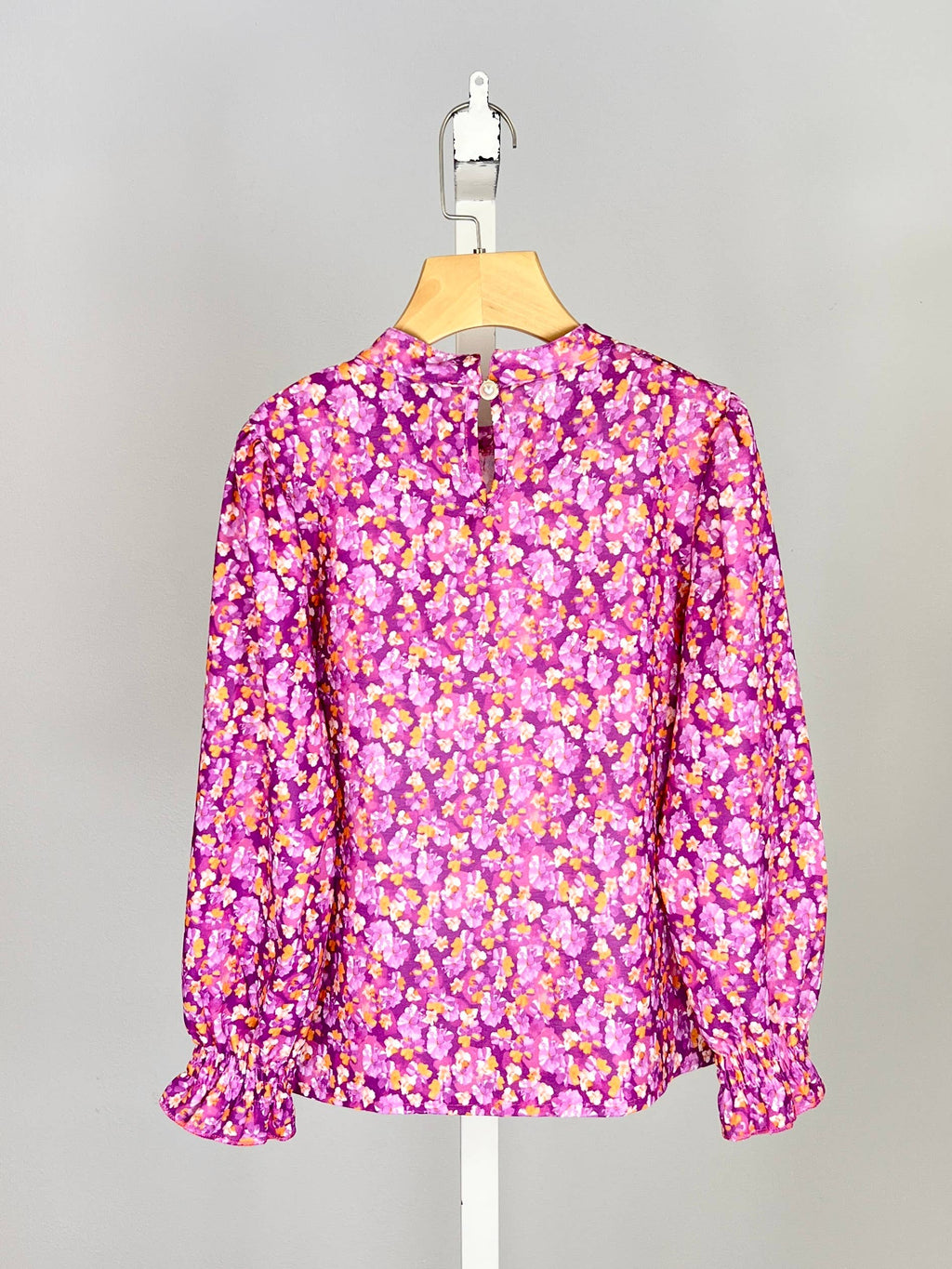 Floral top with small bow and ruffle for girl