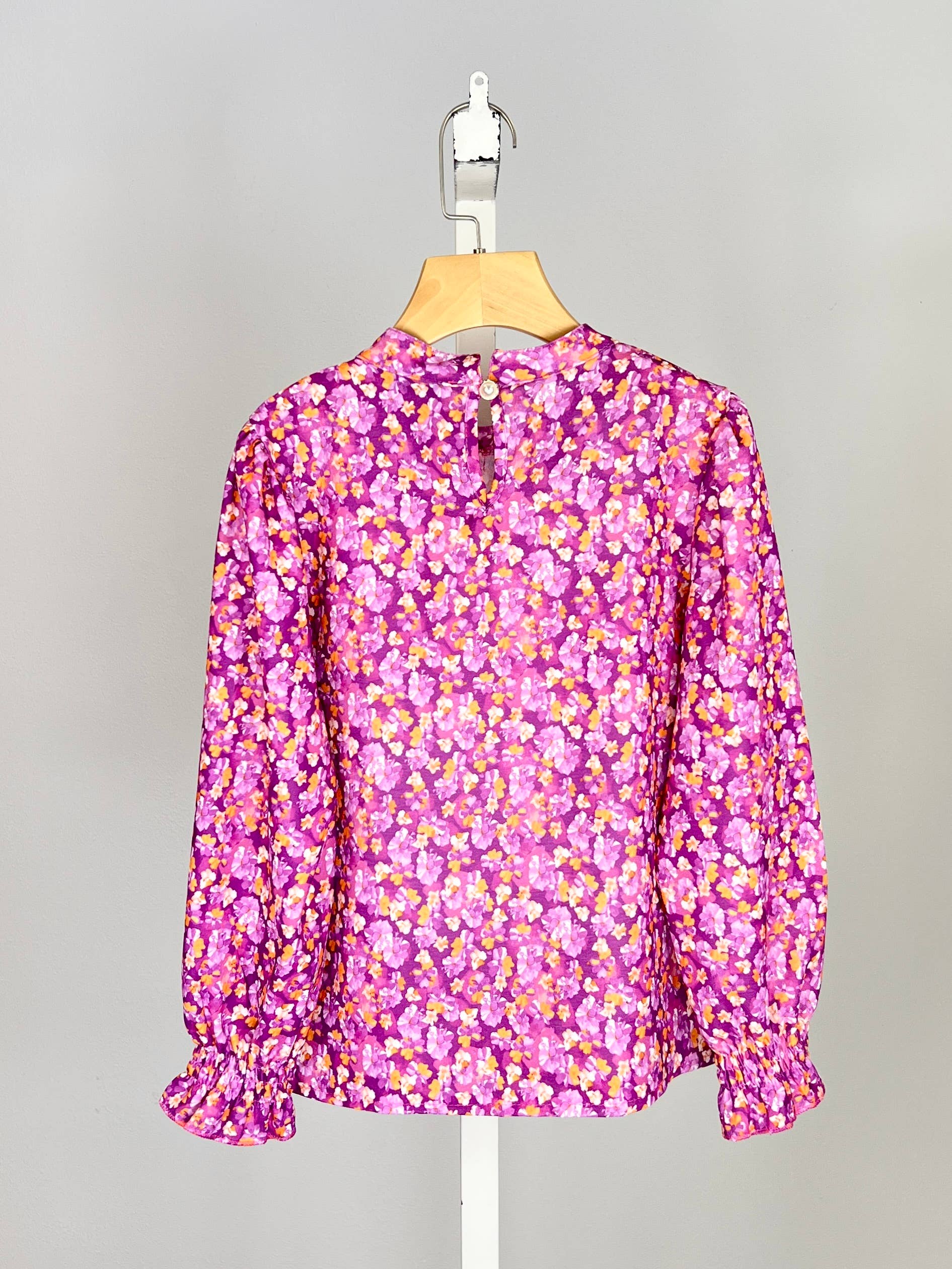 Floral top with small bow and ruffle for girl