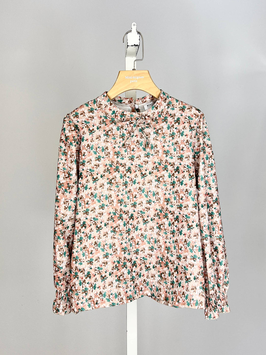 Floral top with small bow and ruffle for girl