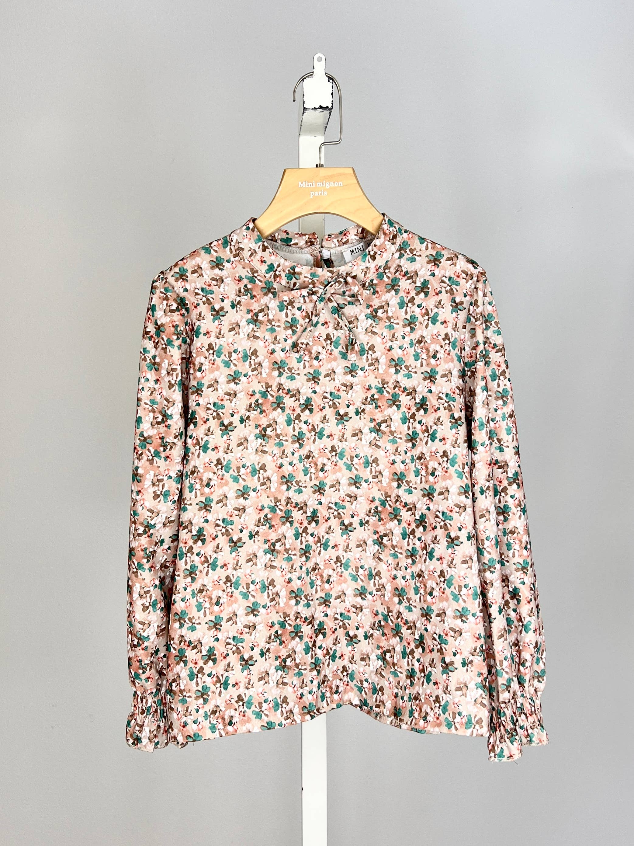 Floral top with small bow and ruffle for girl