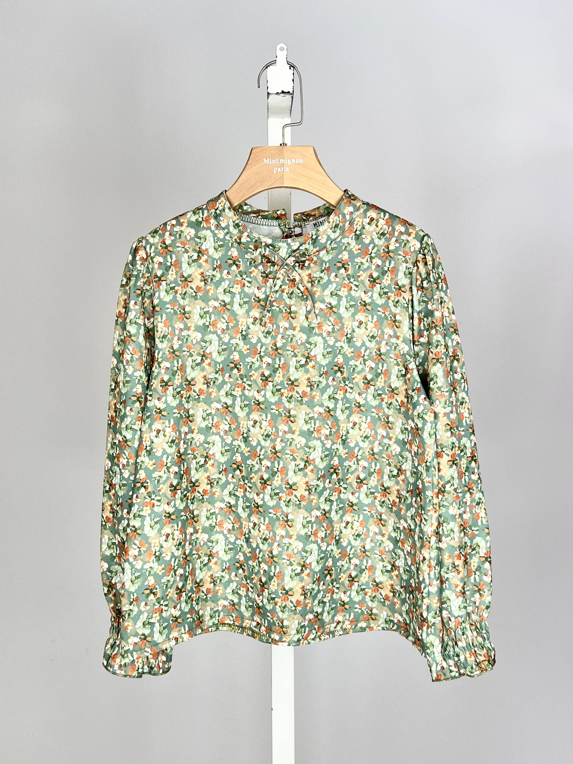 Floral top with small bow and ruffle for girl